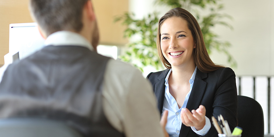 A talent agent meets with a potential client in her office.