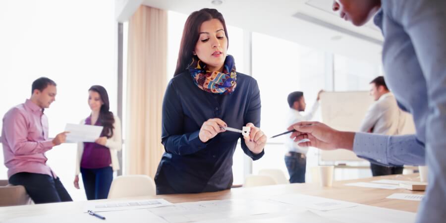 product designers discussing about designs in a open space